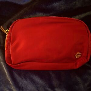 lululemon athletica Red Zip Pouch with Gold Hardware